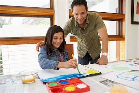 parents sitting with kids for crafts - Father Watching Daughter Paint Stock Photo - Rights-Managed, Code: 700-01572115