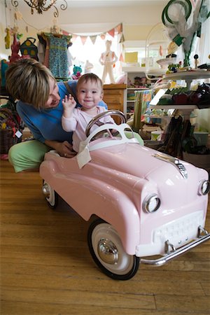 Mother and Baby in Toy Car Stock Photo - Rights-Managed, Code: 700-01586095