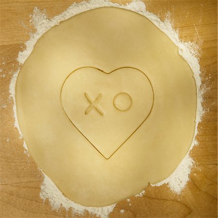 Cookie Dough Cut into a Heart Shape with X and O in Center Stock Photo - Rights-Managed, Code: 700-01586815