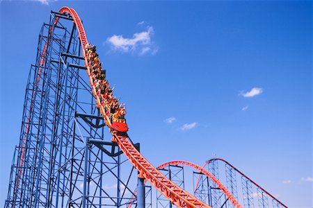 people riding roller coasters - Ride of Steel Roller Coaster, 6 Flags Darien Lake Amusement Park, Darien Center, New York, USA Foto de stock - Con derechos protegidos, Código: 700-01587277