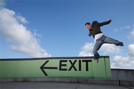 dramatic dancer jump photography - Man Dancing in Parking Lot Stock Photo - Rights-Managed, Code: 700-01587397
