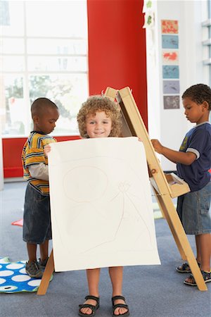 simsearch:700-01295913,k - Child Showing Artwork at Daycare Stock Photo - Rights-Managed, Code: 700-01593795