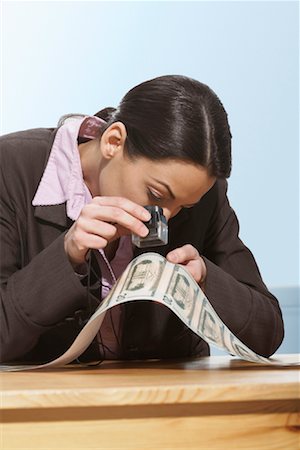 Businesswoman Inspecting Money Foto de stock - Con derechos protegidos, Código: 700-01606335