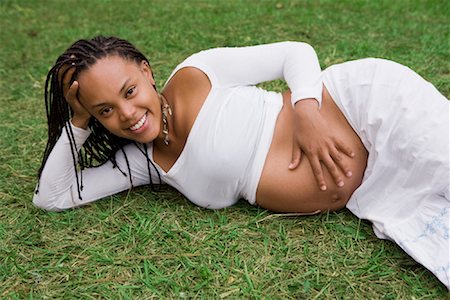 dreadlocks on african americans - Pregnant Woman Lying on Grass Stock Photo - Rights-Managed, Code: 700-01615095