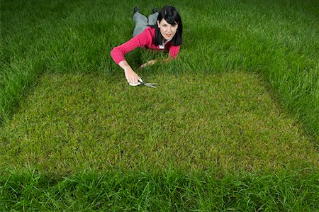 Woman Cutting Grass With Scissors Stock Photo - Rights-Managed, Code: 700-01633295