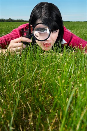 distorted - Woman Examining Grass With Magnifying Glass Stock Photo - Rights-Managed, Code: 700-01633307