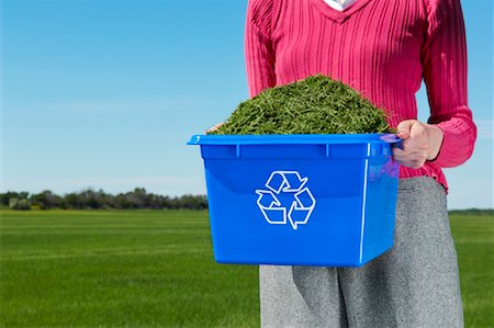 Woman Holding Recycling Box Full of Grass Clippings Stock Photo - Rights-Managed, Code: 700-01633321