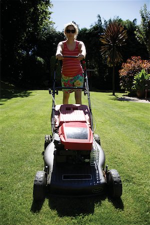 Woman Mowing the Lawn Stock Photo - Rights-Managed, Code: 700-01645247