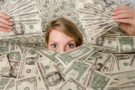 Woman Surrounded by Money Stock Photo - Rights-Managed, Code: 700-01646204