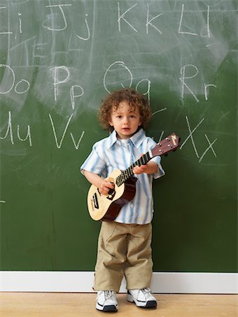 Boy in Classroom with Ukulele Stock Photo - Rights-Managed, Code: 700-01646385