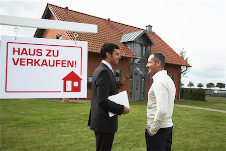 Man With Real Estate Agent in Front of House Stock Photo - Rights-Managed, Code: 700-01716466