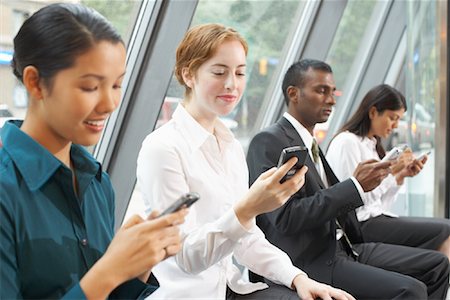 Business People in Foyer with Electronic Organizers, Toronto, Ontario, Canada Stock Photo - Rights-Managed, Code: 700-01764206
