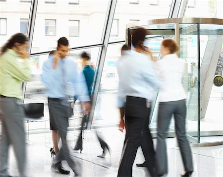 Business People Walking in Foyer with Cellular Phones, Toronto, Ontario, Canada Stock Photo - Rights-Managed, Code: 700-01764219