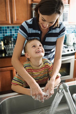 Mother Helping Son Wash Hands Stock Photo - Rights-Managed, Code: 700-01787791
