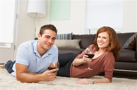 shag carpet - Couple Lying on Living Room Floor Drinking Wine Stock Photo - Rights-Managed, Code: 700-01788177