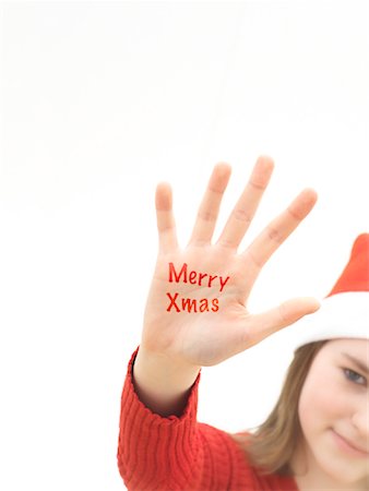 Girl with Merry Christmas Written on Hand Stock Photo - Rights-Managed, Code: 700-01788261
