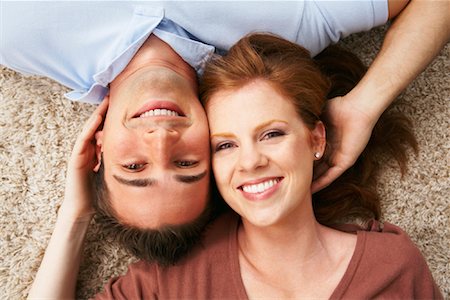 Portrait of Couple Lying on Floor Stock Photo - Rights-Managed, Code: 700-01792315