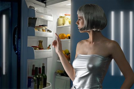 Woman Looking into Open Refrigerator Stock Photo - Rights-Managed, Code: 700-01792435