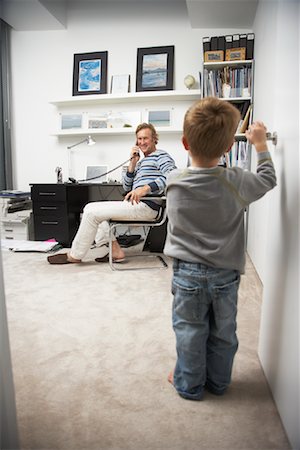 Child Standing in Doorway of Man's Office Stock Photo - Rights-Managed, Code: 700-01827616