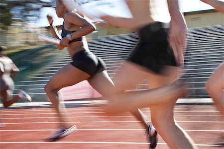 Athletes Running in Relay Race Stock Photo - Rights-Managed, Code: 700-01837295