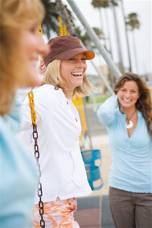 Women on Swing Set, Newport Beach, Orange County, California, USA Stock Photo - Rights-Managed, Code: 700-01837362