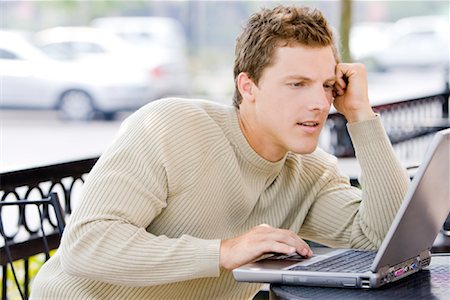 people seating at restaurant - Man Using Laptop Computer Outdoors Stock Photo - Rights-Managed, Code: 700-01880134