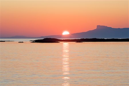 Sun Setting behind Isle of Eigg, Glenancross, Scotland Stock Photo - Rights-Managed, Code: 700-01880388