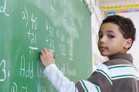 Student Writing on Chalkboard Foto de stock - Con derechos protegidos, Código: 700-01954522