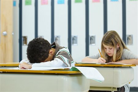 sleeping in class pictures blacks - Students in Classroom, Boy Resting Head on Desk Stock Photo - Rights-Managed, Code: 700-01954531