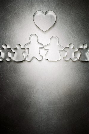 putting the pieces together - Gingerbread Man and Woman Cookie Cutter Family with Heart Shaped Cookie Cutter Stock Photo - Rights-Managed, Code: 700-01955420