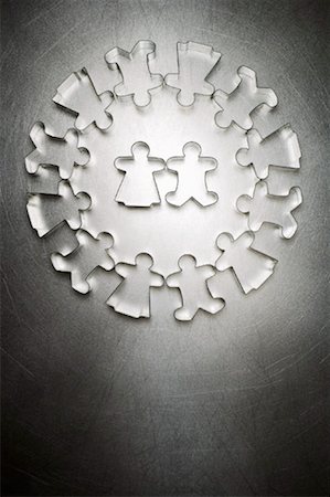 partner, concept - Gingerbread Man and Gingerbread Women Cookie Cutters in Center of Circle of Others Stock Photo - Rights-Managed, Code: 700-01955422