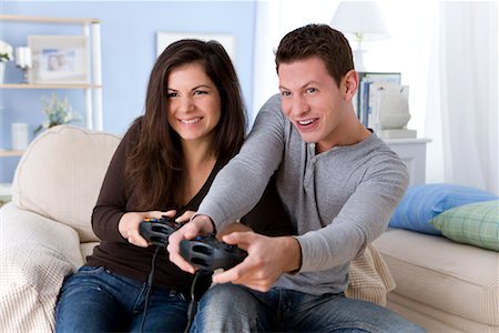 Couple Playing Video Games Foto de stock - Con derechos protegidos, Código: 700-01955508