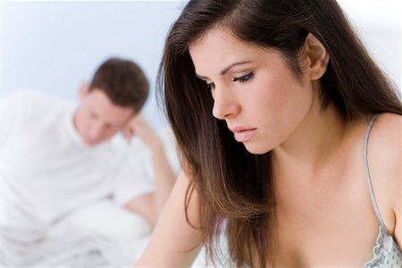 depressed young man - Couple in Bed, Woman Looking Upset Stock Photo - Rights-Managed, Code: 700-01955512