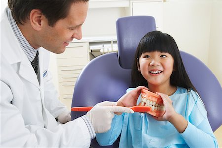 dentist with patient in exam room - Girl at Dentist Stock Photo - Rights-Managed, Code: 700-01992997