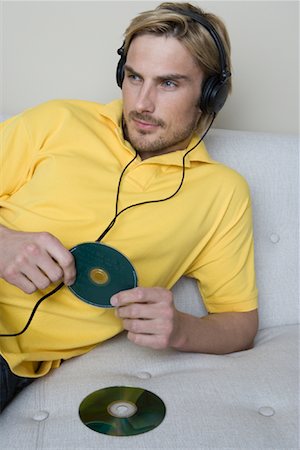 Man Listening to CDs Stock Photo - Rights-Managed, Code: 700-02033887