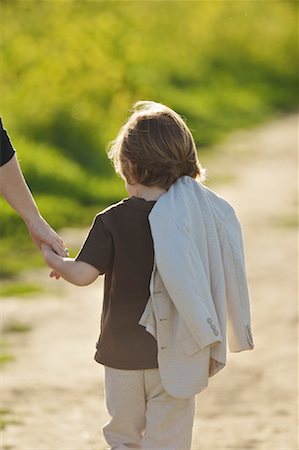 Boy Walking Outdoors With Mom, Costa Mesa, Newport Beach, Orange County, California, USA Stock Photo - Rights-Managed, Code: 700-02046152
