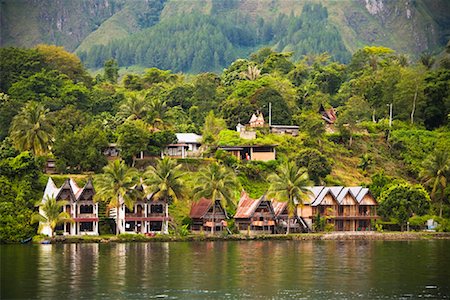 sumatra tourist destinations - Traditional Buildings on Lake Shore, Lake Toba, Sumatra, Indonesia Stock Photo - Rights-Managed, Code: 700-02046530