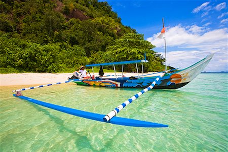 Boat by Shoreline, Bungus Bay, Sumatra, Indonesia Stock Photo - Rights-Managed, Code: 700-02046610