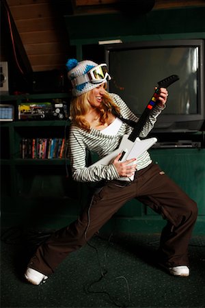 Woman Playing Guitar Video Game Stock Photo - Rights-Managed, Code: 700-02046923