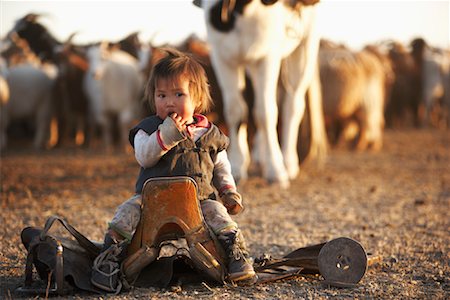 simsearch:700-02586125,k - Girl on Saddle by Herd of Sheep, Khustain Nuruu National Park, Mongolia Stock Photo - Rights-Managed, Code: 700-02046993