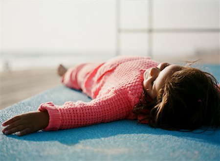foreshortening people - Girl Lying Down, Huntington Beach, California, USA Stock Photo - Rights-Managed, Code: 700-02063383