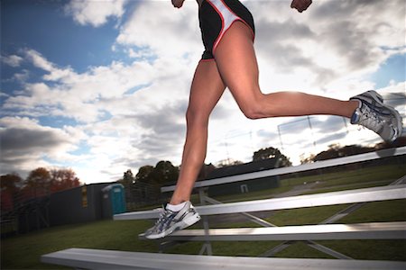 Woman Exercising on Bleachers Stock Photo - Rights-Managed, Code: 700-02063985