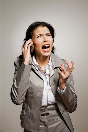 simsearch:400-05366591,k - Angry Businesswoman Talking on Cellular Phone Stock Photo - Rights-Managed, Code: 700-02071392