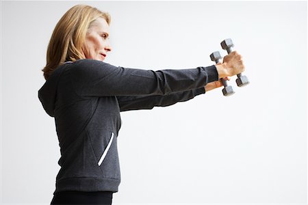 serious 60  exercise - Woman Lifting Weights Stock Photo - Rights-Managed, Code: 700-02071486