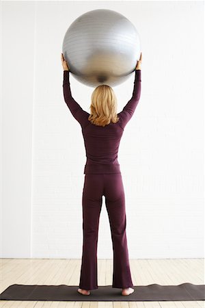 exercise ball - Woman Holding Exercise Ball Stock Photo - Rights-Managed, Code: 700-02071550