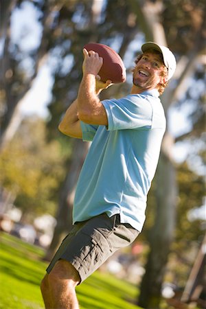 playing american football for fun - Man Throwing Football Stock Photo - Rights-Managed, Code: 700-02125530