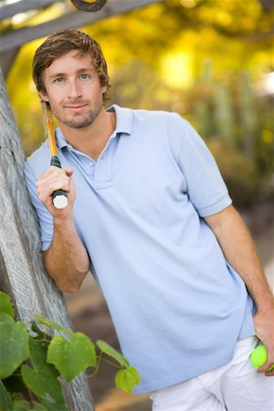 Portrait of Man Holding Tennis Racquet and Tennis Ball Stock Photo - Rights-Managed, Code: 700-02125546