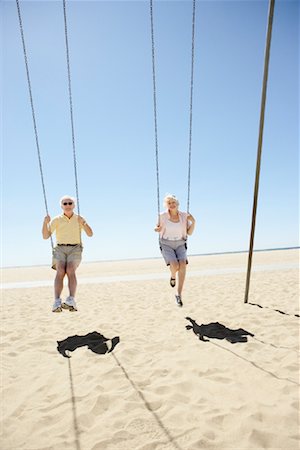 Senior Couple on Swings, Santa Monica Pier, Santa Monica, California, USA Stock Photo - Rights-Managed, Code: 700-02125699