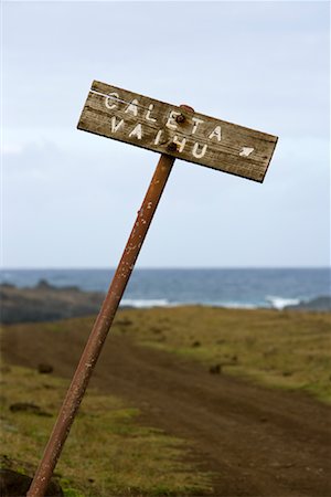 direction sign and nobody road - Sign and Road to Caleta Vaihu, Easter Island, Chile Stock Photo - Rights-Managed, Code: 700-02128888