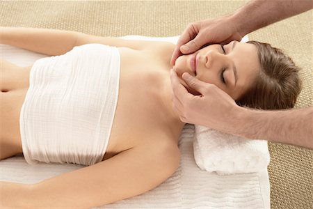 photo of a woman touching a man face - Woman Getting a Massage Stock Photo - Rights-Managed, Code: 700-02121357